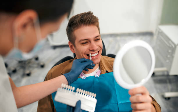 a man choosing a veneer shade for his teeth